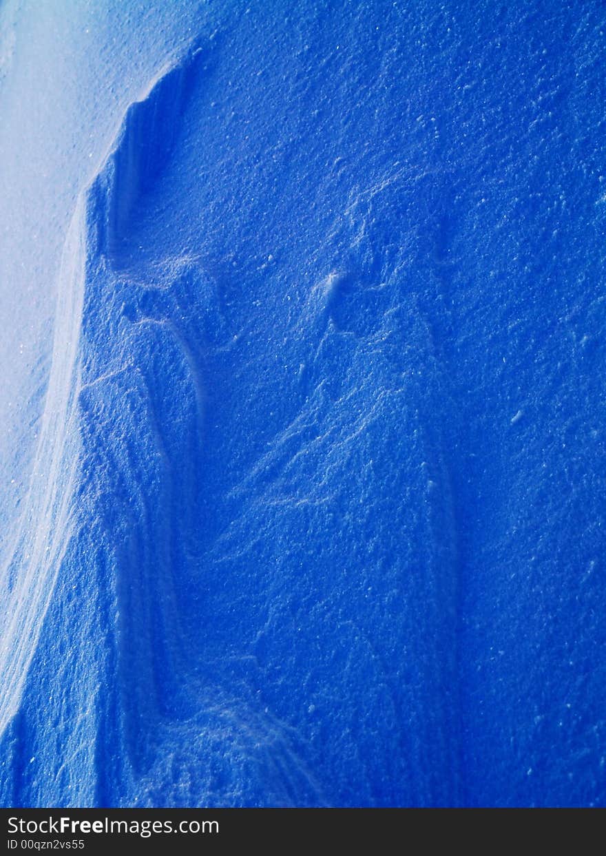 Frozen snow background in blue. Frozen snow background in blue.