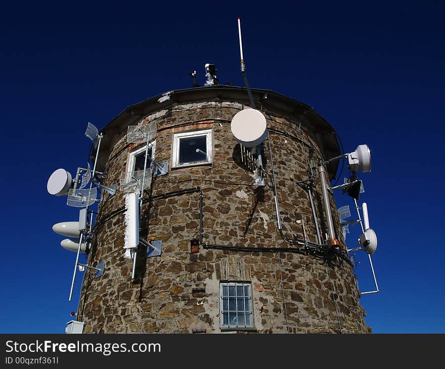 Building with antennas at the mountains