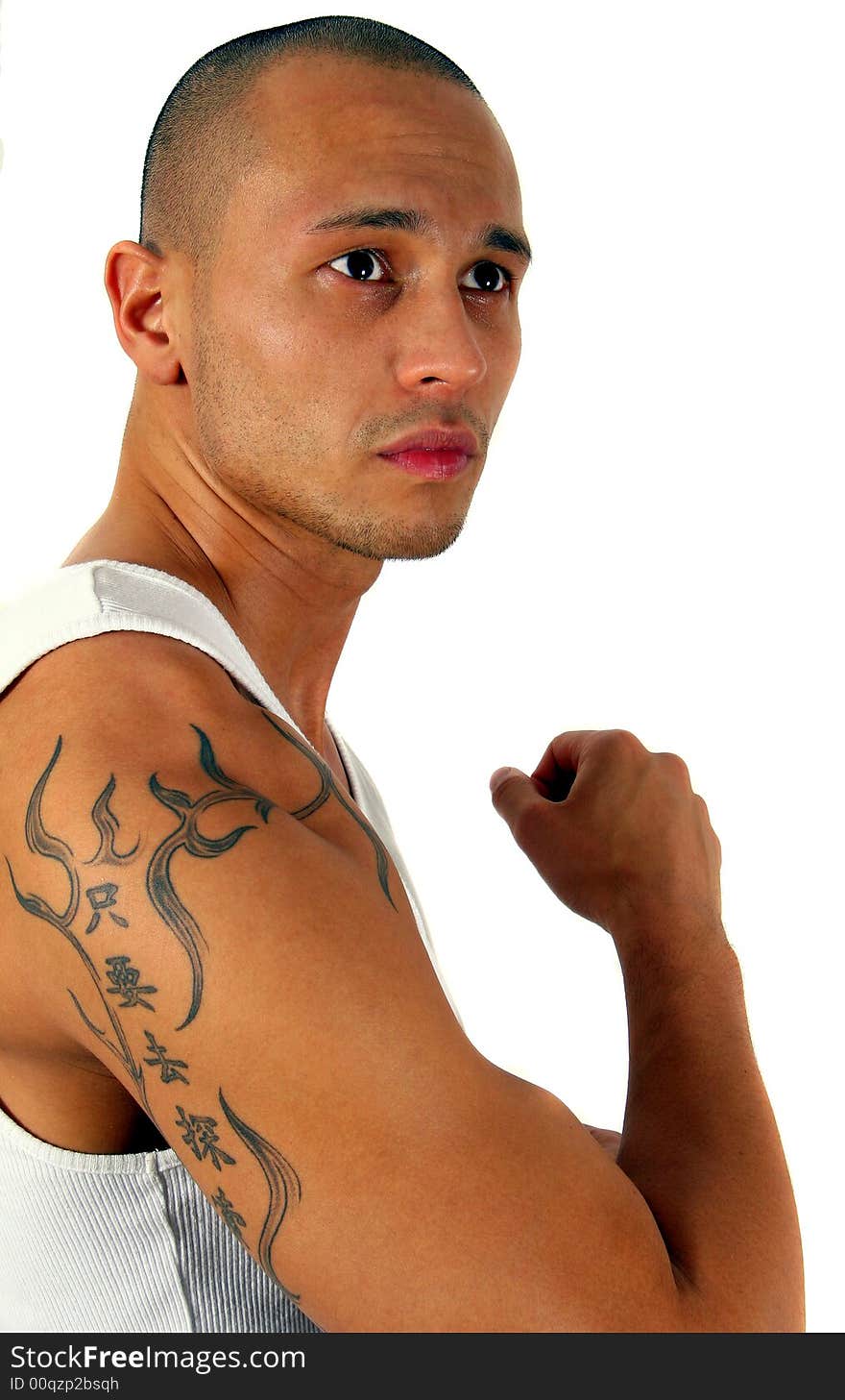 Young man showing his muscles and his tattoo - isolated over white!. Young man showing his muscles and his tattoo - isolated over white!