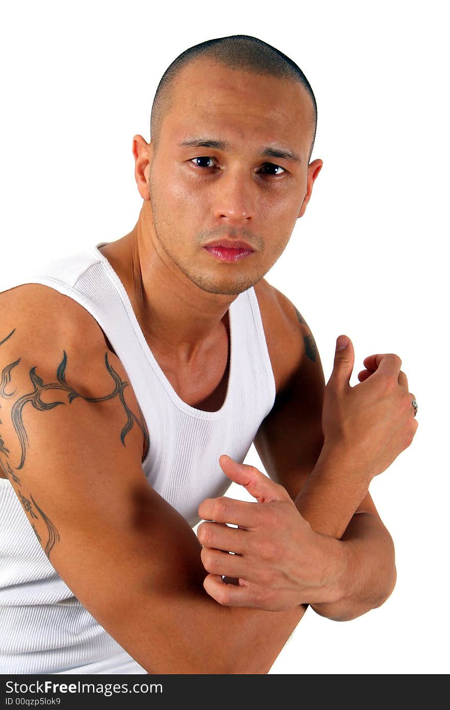 Young man showing his muscles and his tattoo - isolated over white!. Young man showing his muscles and his tattoo - isolated over white!