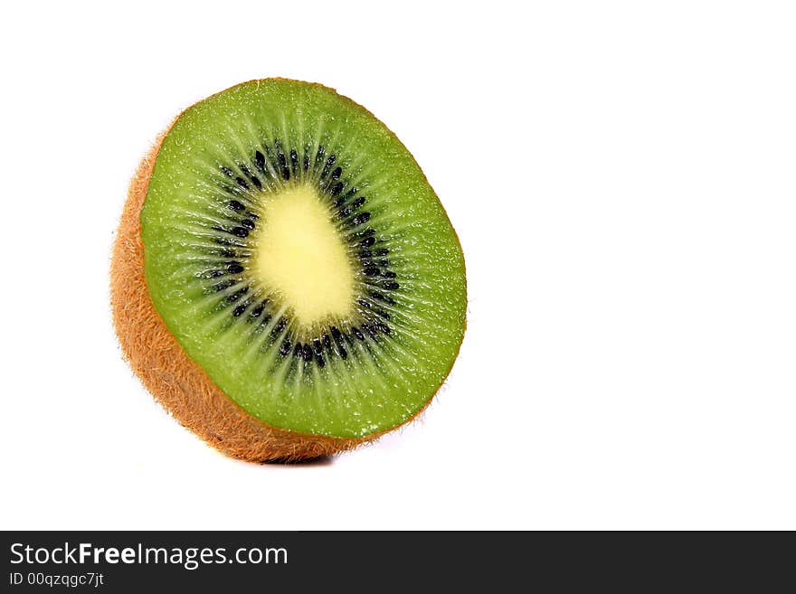 Shot of a kiwi - wet and juicy - over white background. Shot of a kiwi - wet and juicy - over white background.