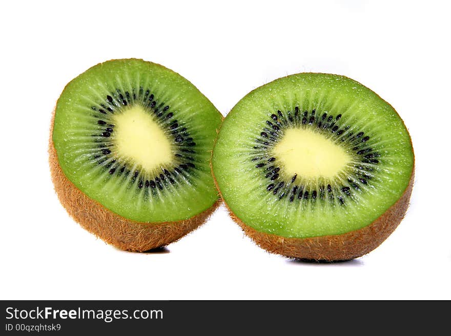 Shot of a kiwi - wet and juicy - over white background. Shot of a kiwi - wet and juicy - over white background.