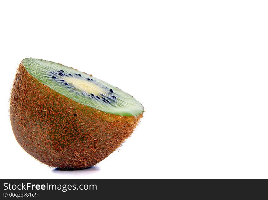 Shot of a kiwi - wet and juicy - over white background. Shot of a kiwi - wet and juicy - over white background.