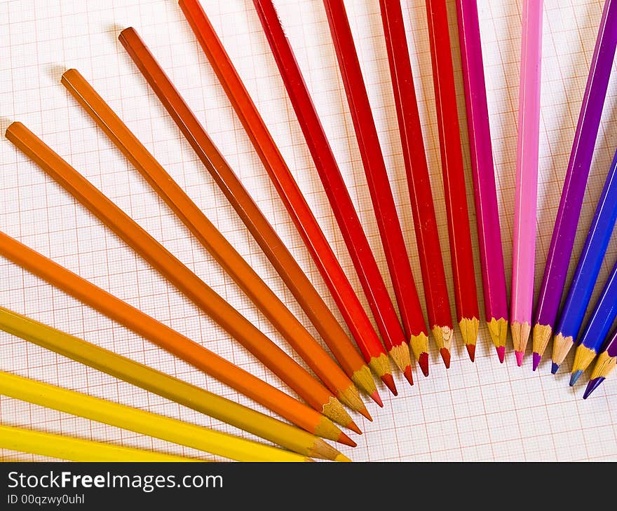 Arrangement of coloured pencils on graph paper. Arrangement of coloured pencils on graph paper