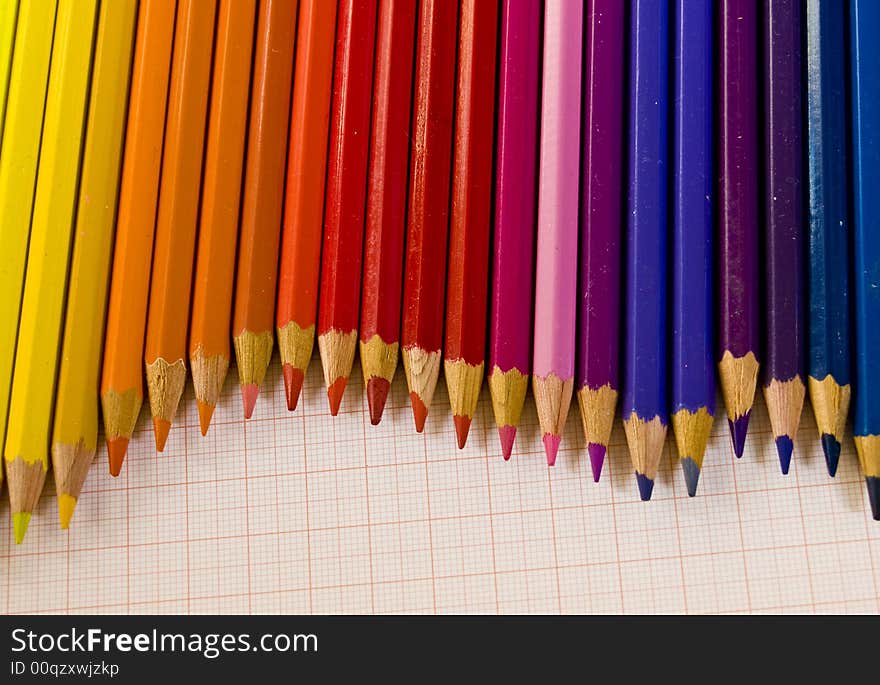 Arrangement of coloured pencils on graph paper. Arrangement of coloured pencils on graph paper