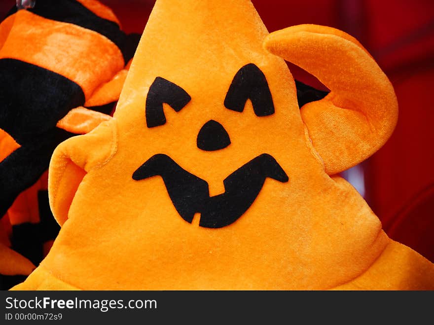 An orange triangle downy cap looks like Hallowmasall costume.