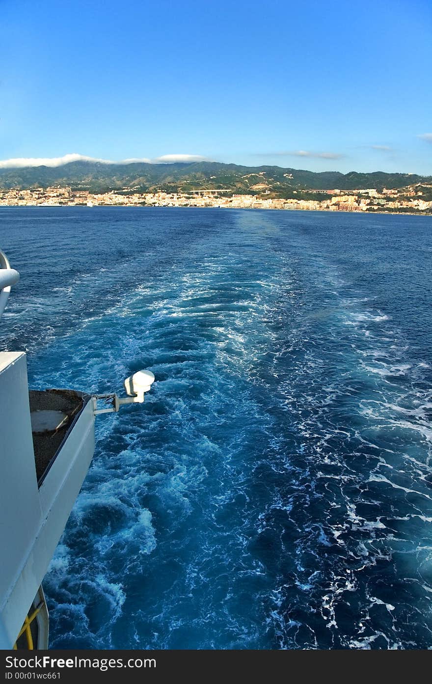 View from a ship with sea waves and distant land. View from a ship with sea waves and distant land