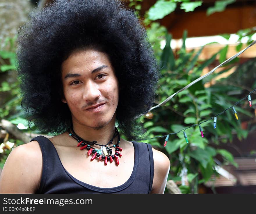 Portrait of a Thai man with a big afro.