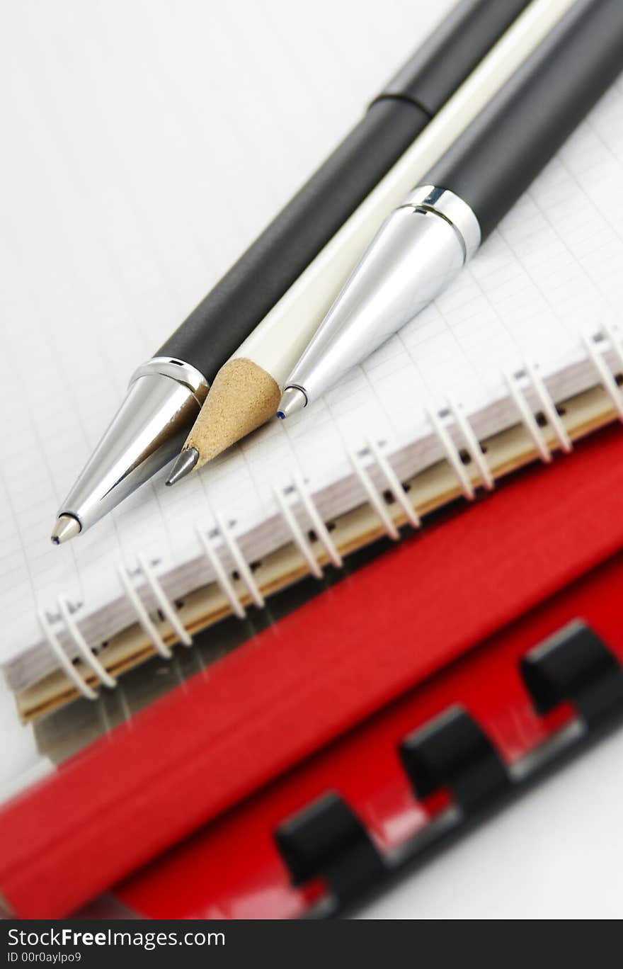 Notebook with a ball-point pen and pencil. Notebook with a ball-point pen and pencil