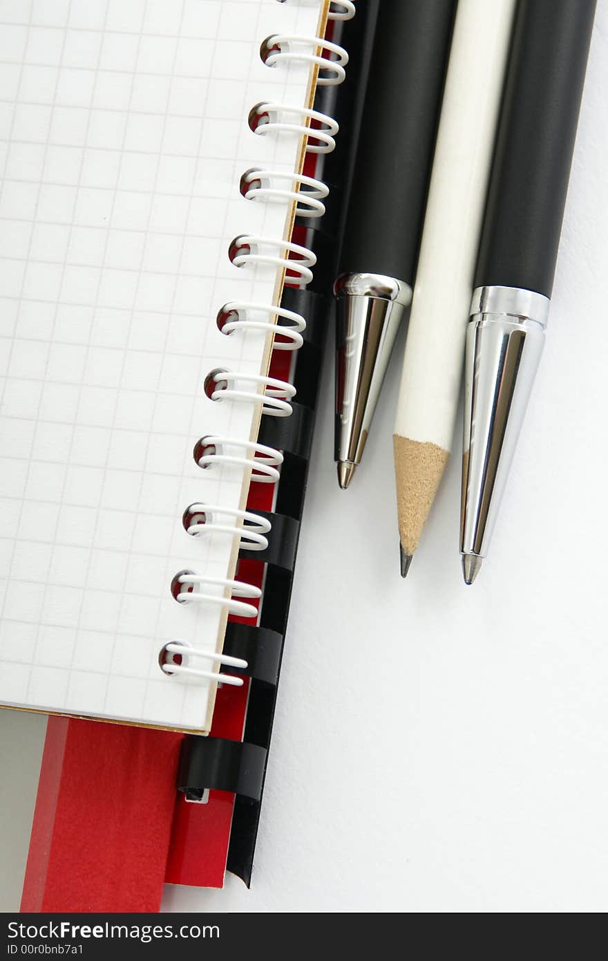 Notebook with a ball-point pen and pencil. Notebook with a ball-point pen and pencil