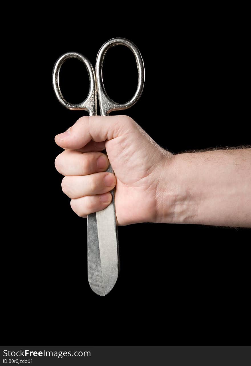 Scissors in a hand