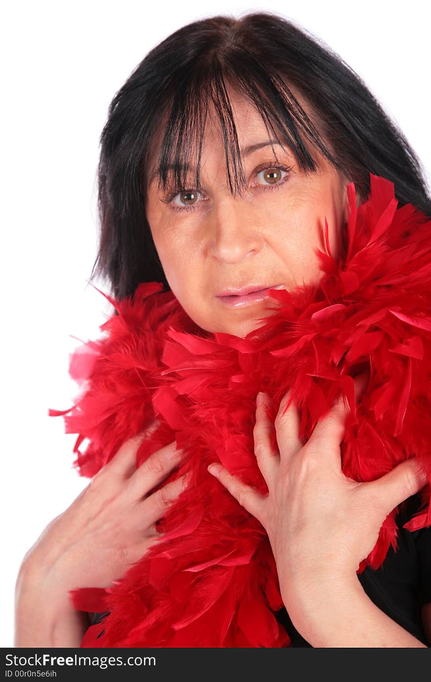 Woman in red feather shawl on white