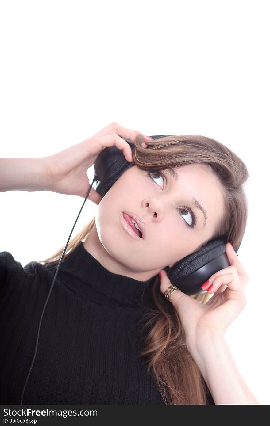 Cute brunette listening to music over white. Cute brunette listening to music over white