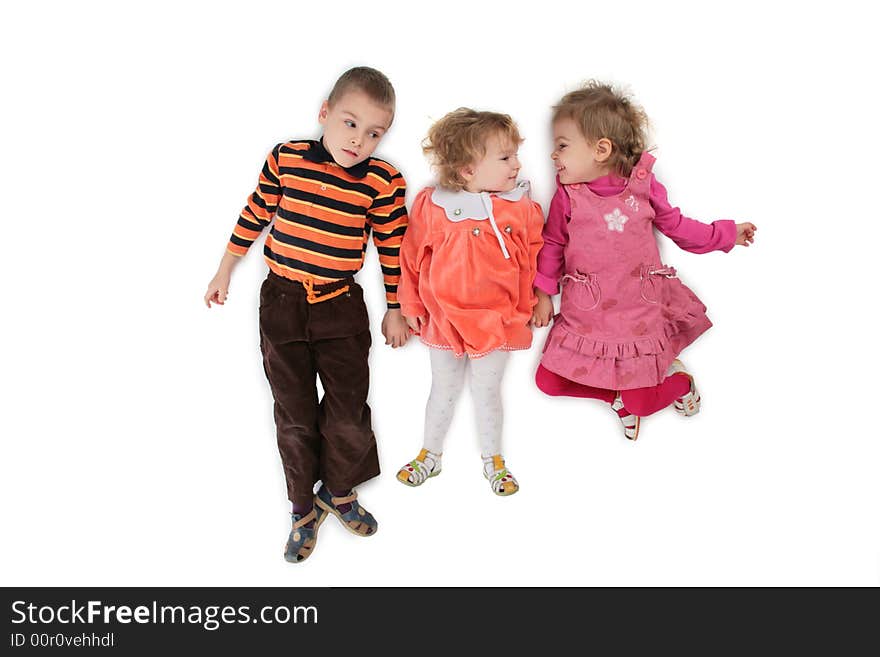 Three children lying top view on white 2. Three children lying top view on white 2