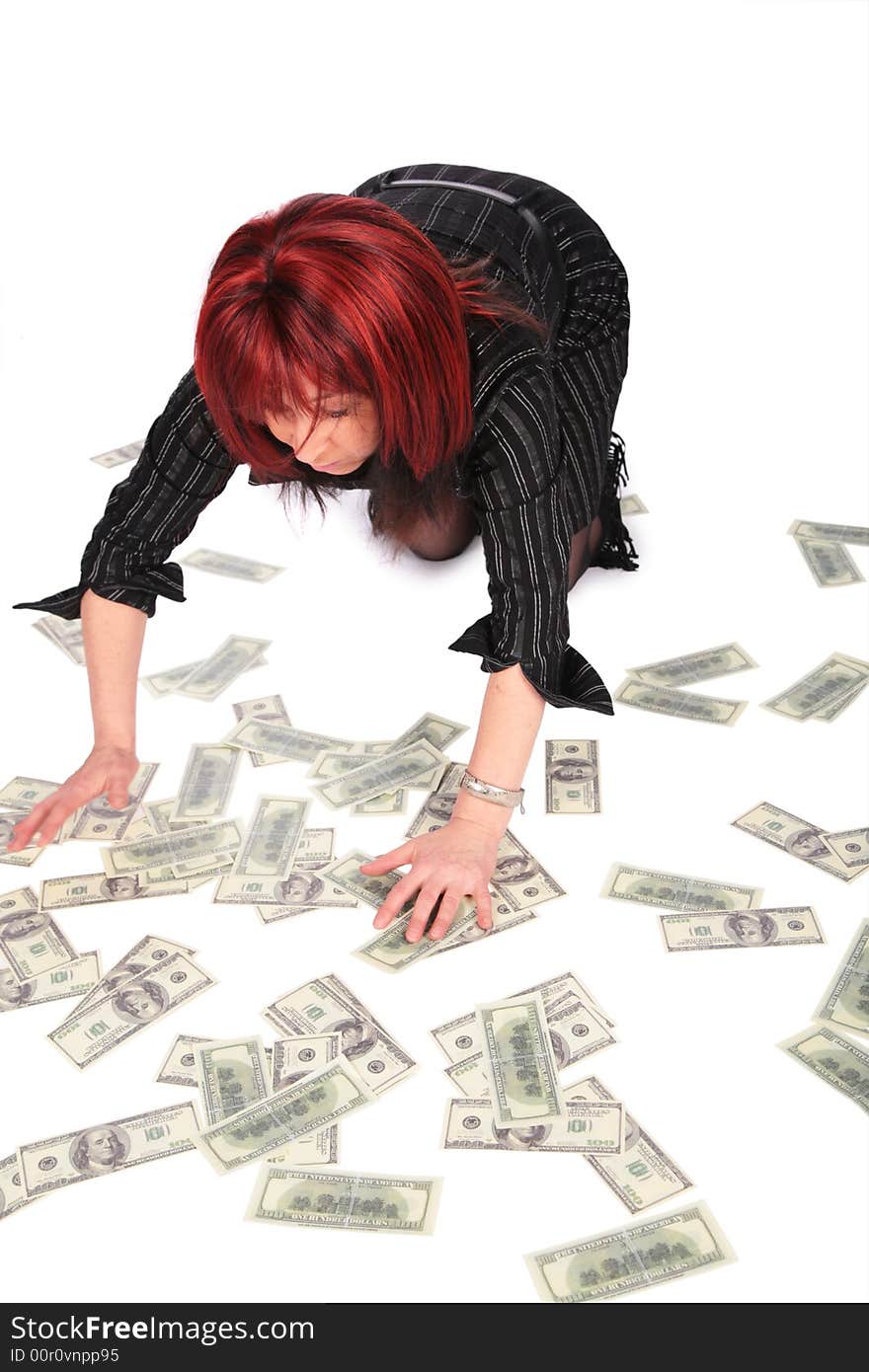 Woman gathering dollars on white