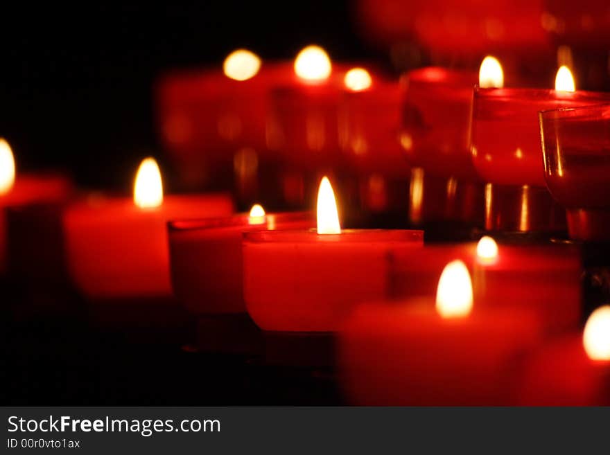 Small candles in rows in a church