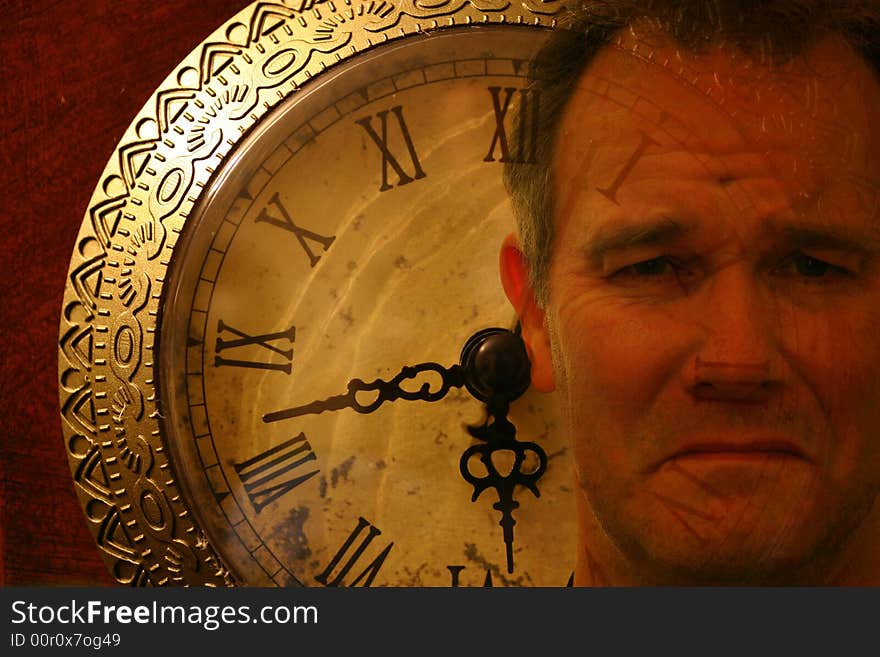Man's face with sad expression superimposed on a clock face. Man's face with sad expression superimposed on a clock face