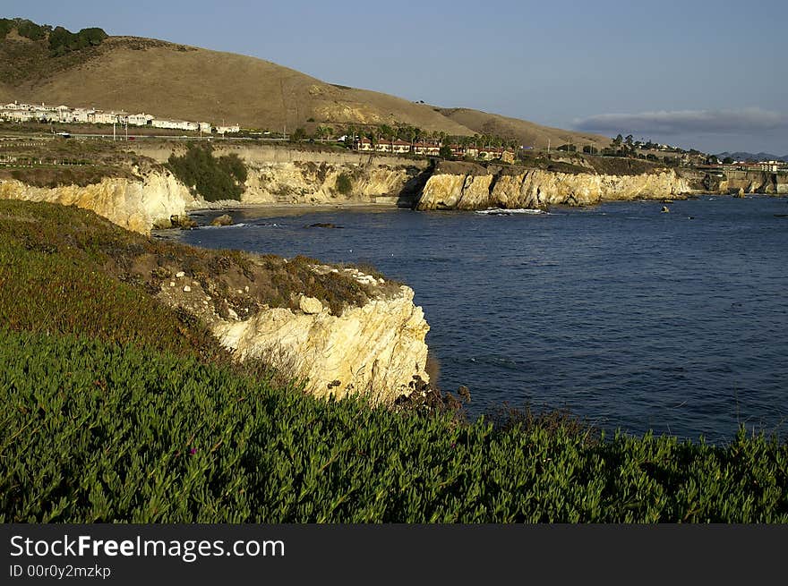 Rocky coastline meets water of california shore. Rocky coastline meets water of california shore