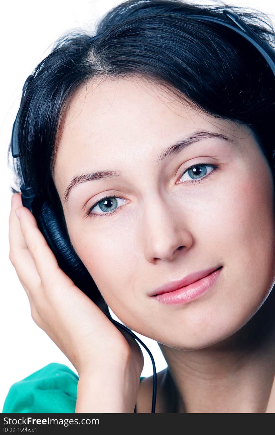 Beautiful girl listen a music in a headphones. Beautiful girl listen a music in a headphones