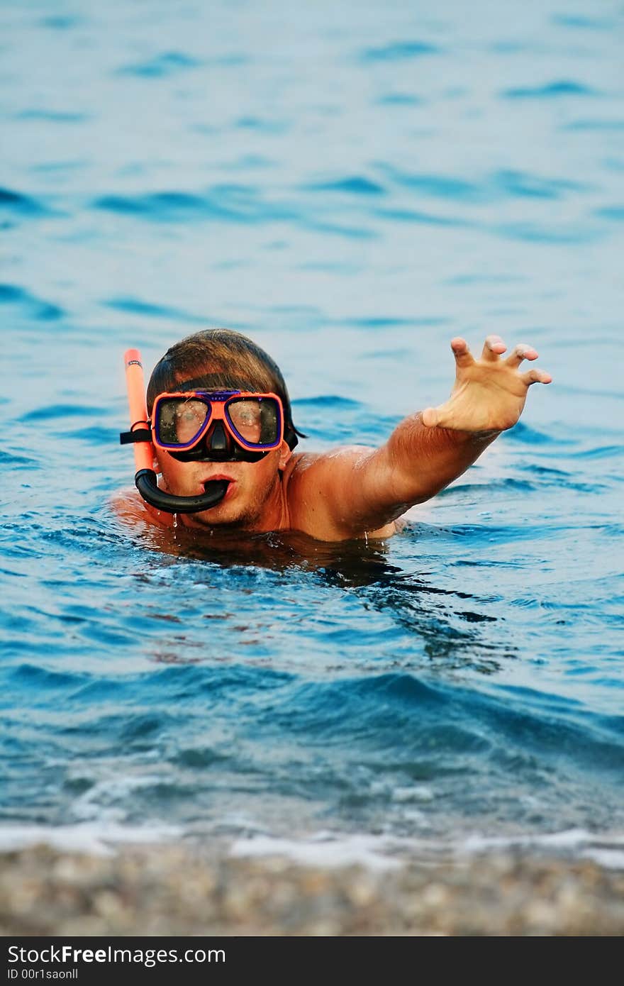 Man in diving mask in sea. Man in diving mask in sea