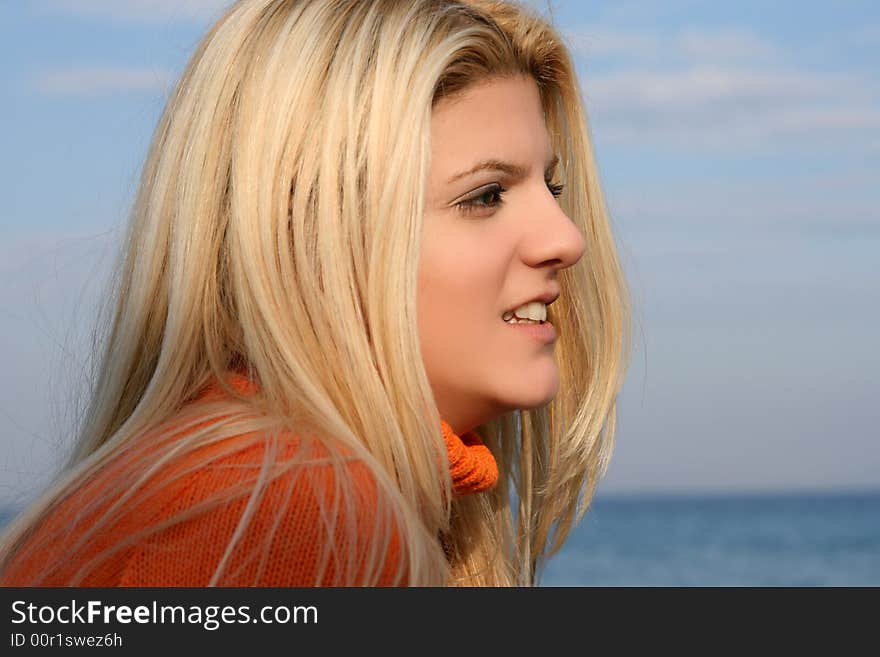 A young blonde smiling woman with long hair. A young blonde smiling woman with long hair