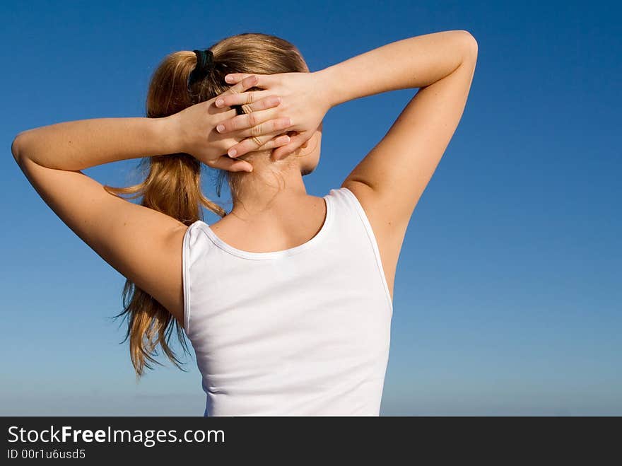 Healthy young woman doing stretching exercises. Healthy young woman doing stretching exercises