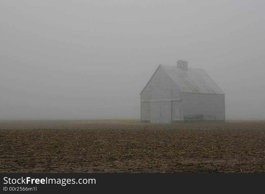 An isolated barn, on a foggy winter morning. An isolated barn, on a foggy winter morning.