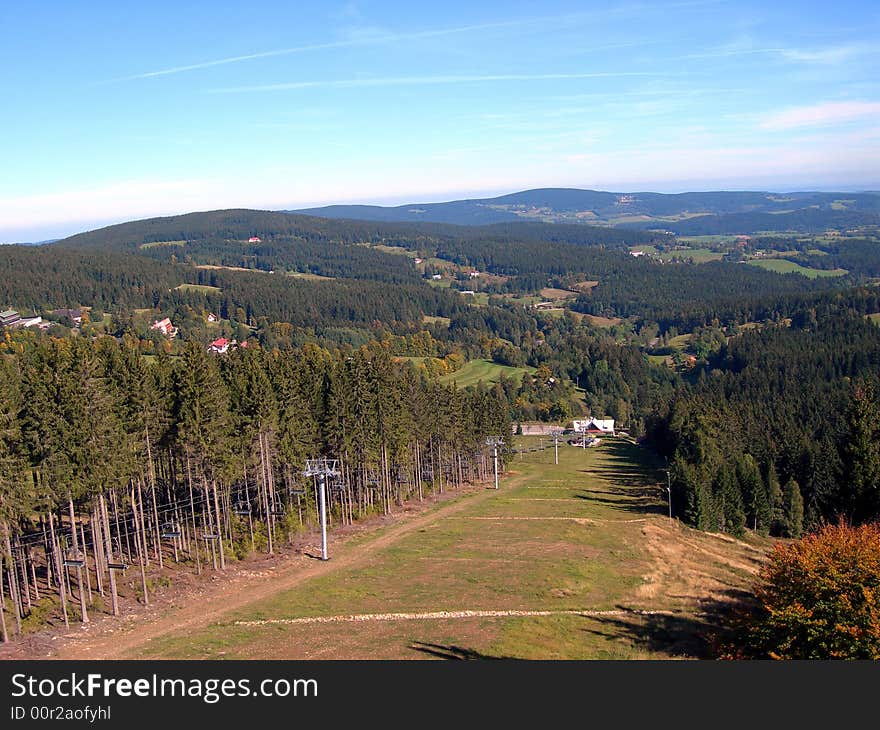 Ski slope in the Czech mountains Sumava with funicular at summer