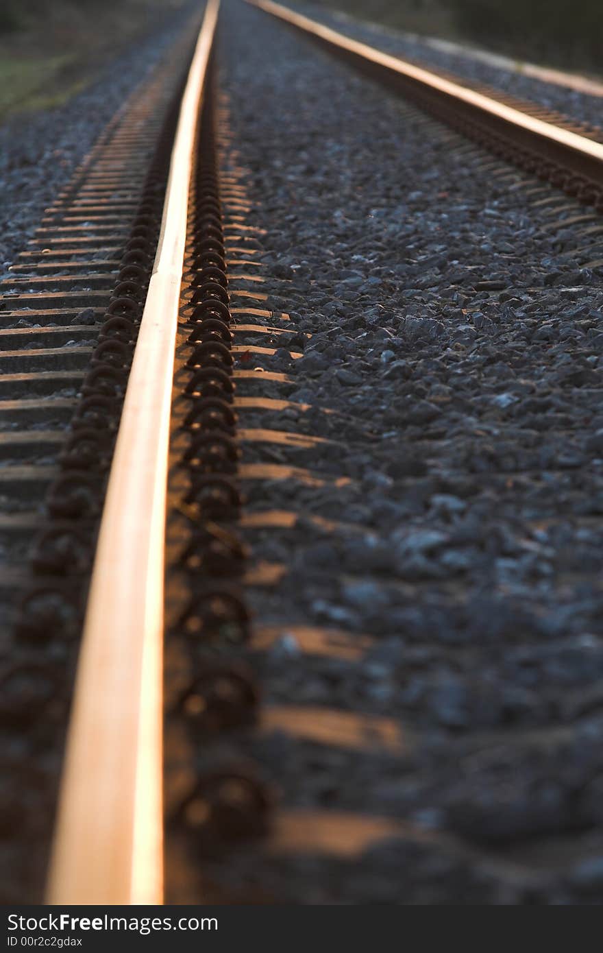 Two rails at sunset going to horizon. Two rails at sunset going to horizon