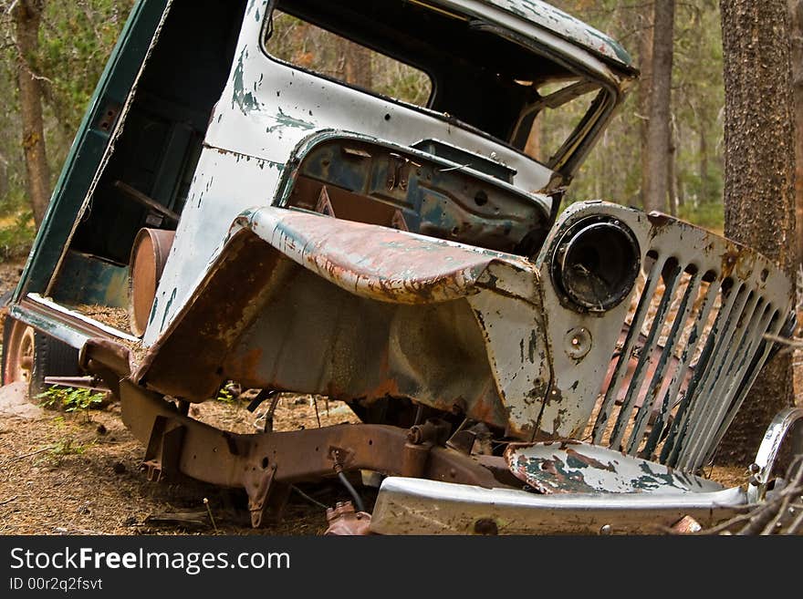 The front view of a jeep that looks like it has been through an earthquake and only part of it remained. The front view of a jeep that looks like it has been through an earthquake and only part of it remained.