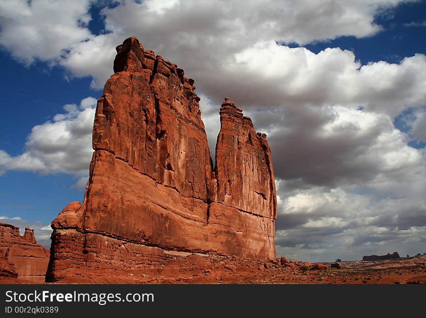 View of the red rock formations in Arches National Park with blue sky�s and clouds. View of the red rock formations in Arches National Park with blue sky�s and clouds