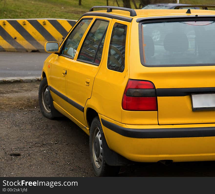 Yellow car near the road