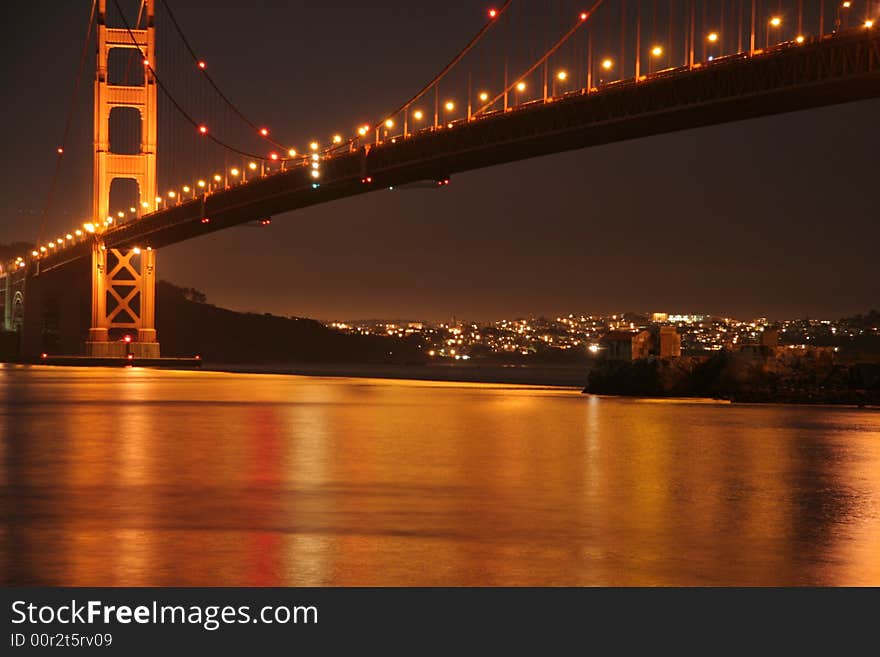 Golden Gate Bridge with Golden Night Light Refection with Point Lime Underneath. Golden Gate Bridge with Golden Night Light Refection with Point Lime Underneath