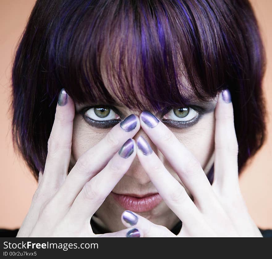 Alternative Young Woman with Her hands in Front of Her Face