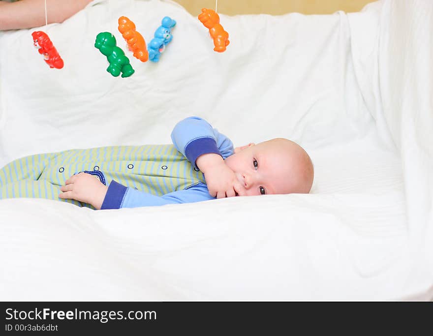 Baby playing with toys. Little boy touching the toys by finger. Baby playing with toys. Little boy touching the toys by finger