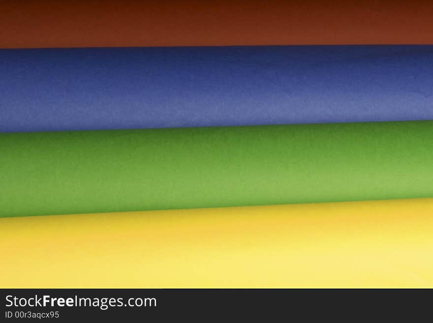 A studio shot of different coloured papers, an ideal background.