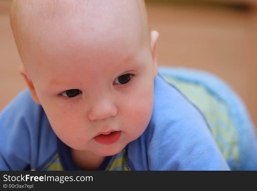 Baby crawling on bed. Close-up. Baby crawling on bed. Close-up.