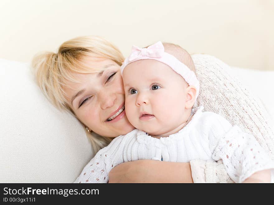 Mother embrace her baby girl