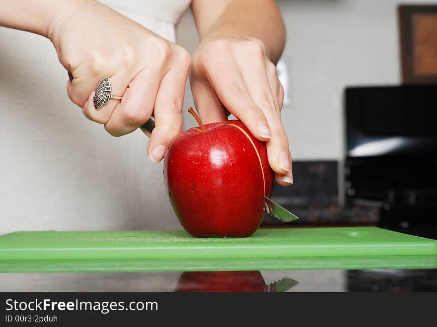 Apple on the counter symbolizes healthy living and nutritional importance. Apple on the counter symbolizes healthy living and nutritional importance