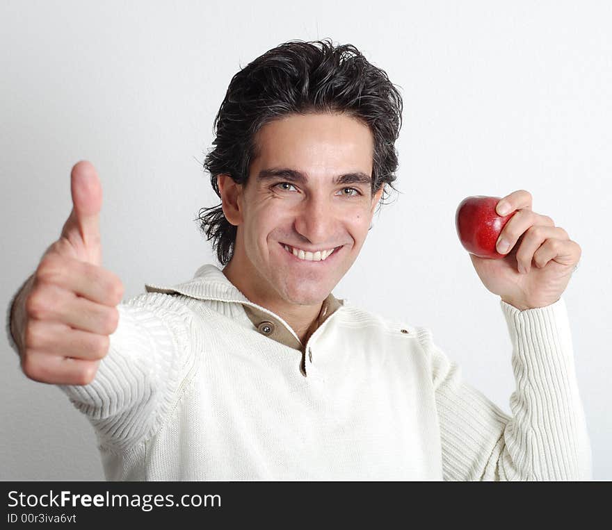 A man is holding fruit in his hands. A man is holding fruit in his hands