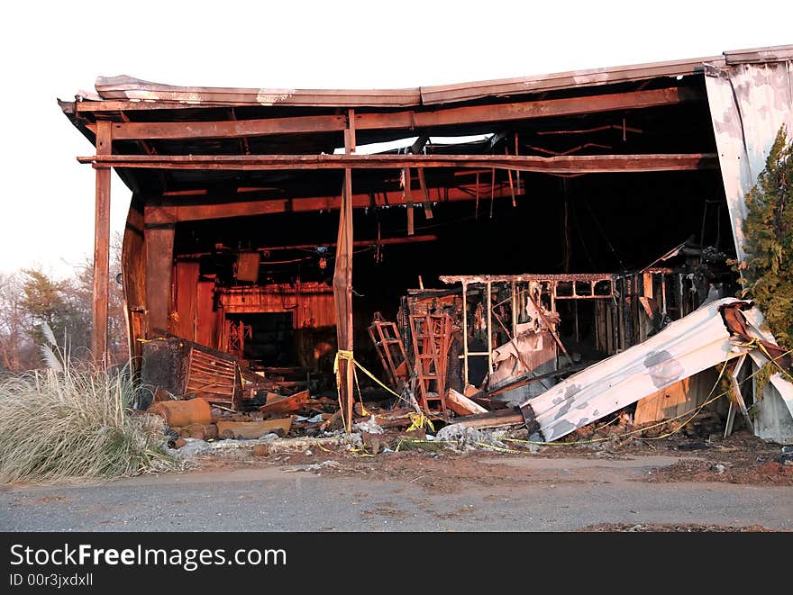 The debris of a warehouse factory building after a fire. The debris of a warehouse factory building after a fire.