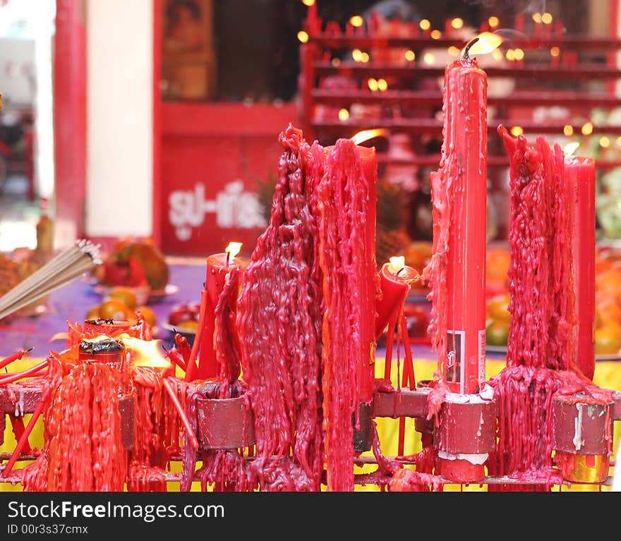 Candles burn at a Chinese temple. Candles burn at a Chinese temple.