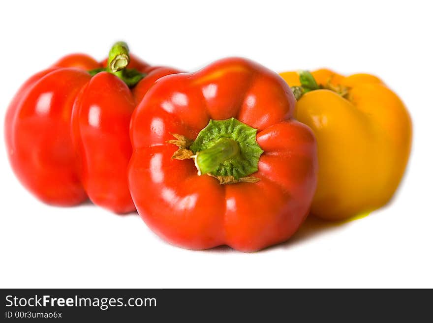 Fresh Red and Yellow Bell Peppers isolated on a white background. Fresh Red and Yellow Bell Peppers isolated on a white background.