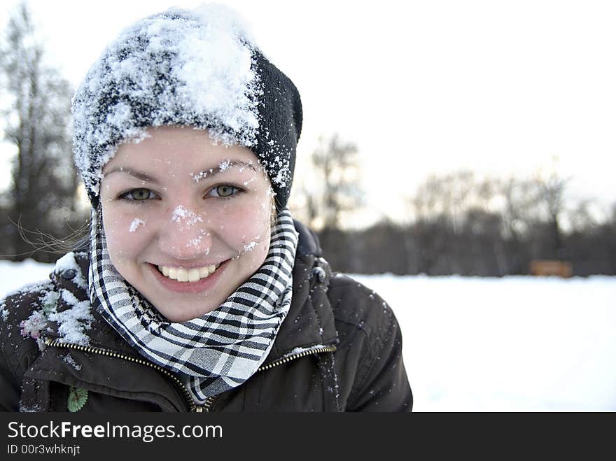 Nice girl's face in snow. Nice girl's face in snow