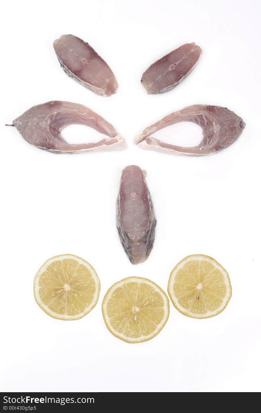 Smiley face made out of slices of fish and lemon