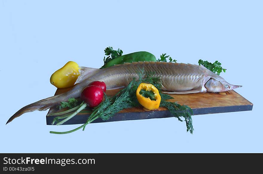 Sturgeon with parsley and pepper on a kitchen