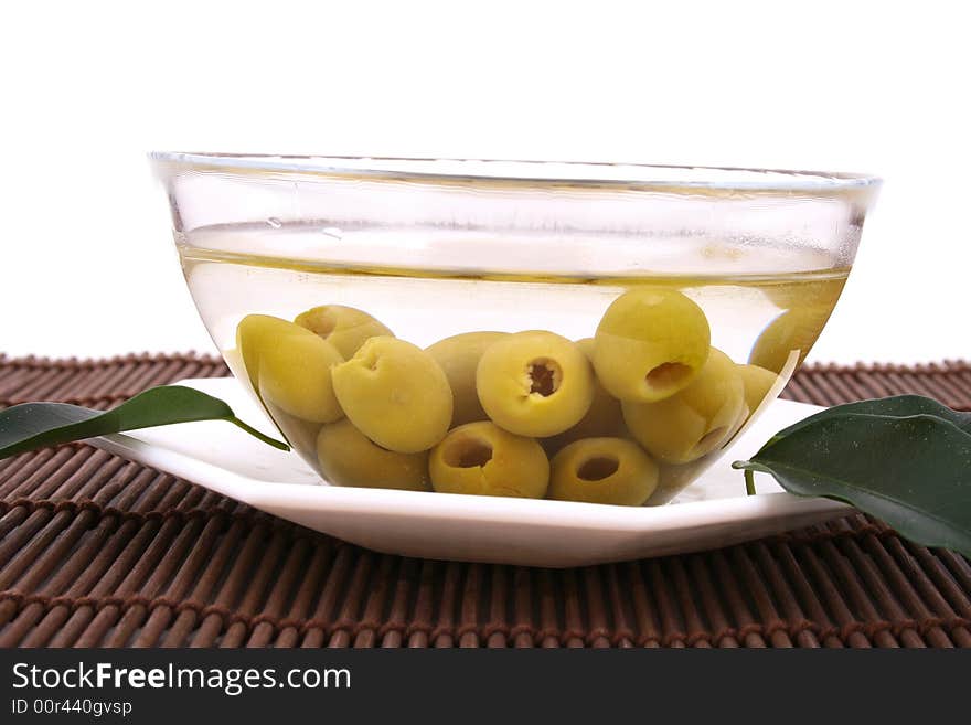 A small bowl of olives on a table