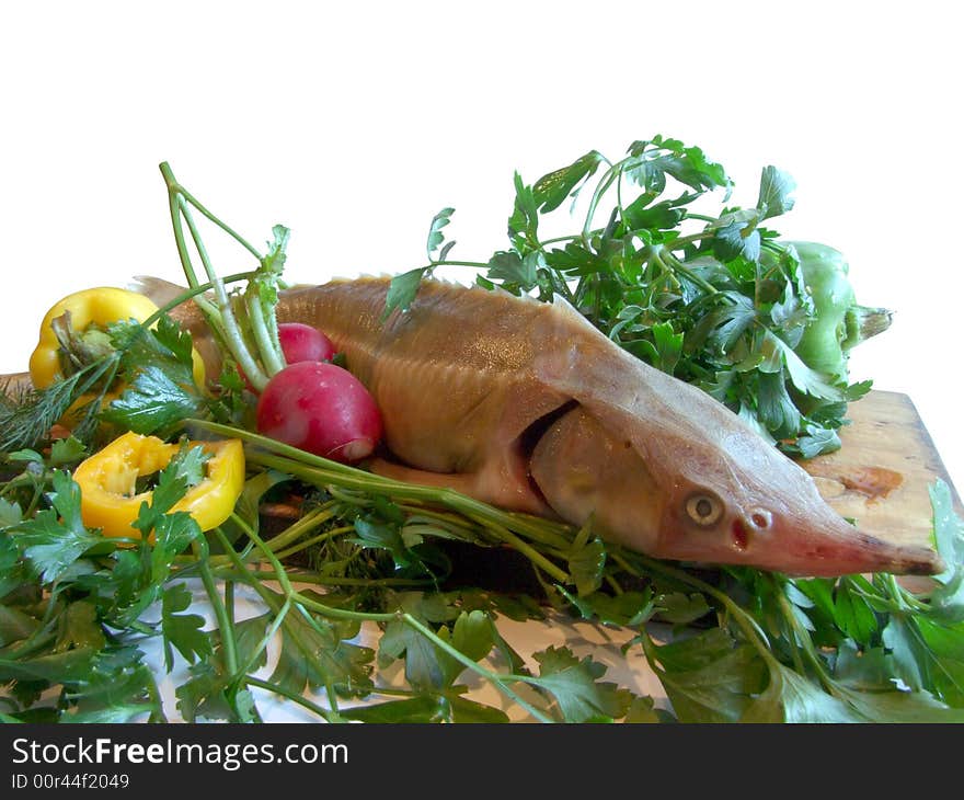 Sturgeon with parsley and pepper on a kitchen