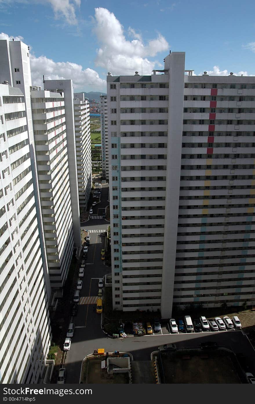 Block of tall apartment buildings in urban area.