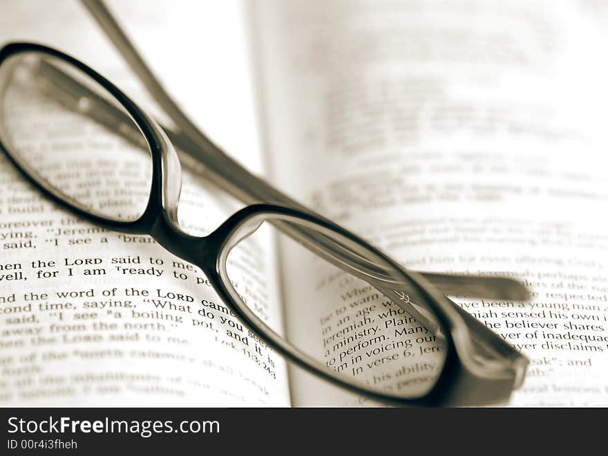 Pair of glasses sitting on a Bible. Pair of glasses sitting on a Bible